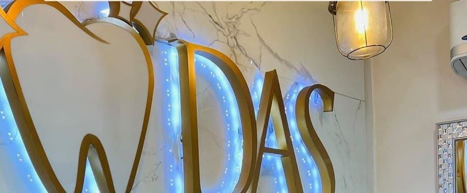 DAS signage with soft blue backlight inside the clinic